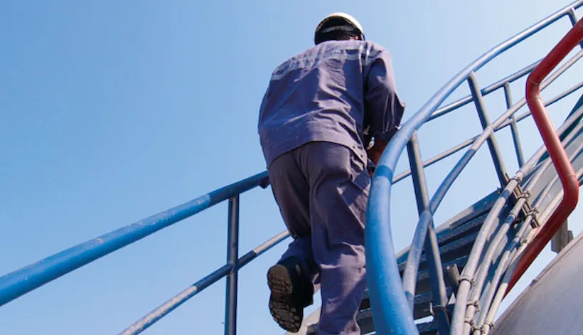 Surveyor on his way up the stairs